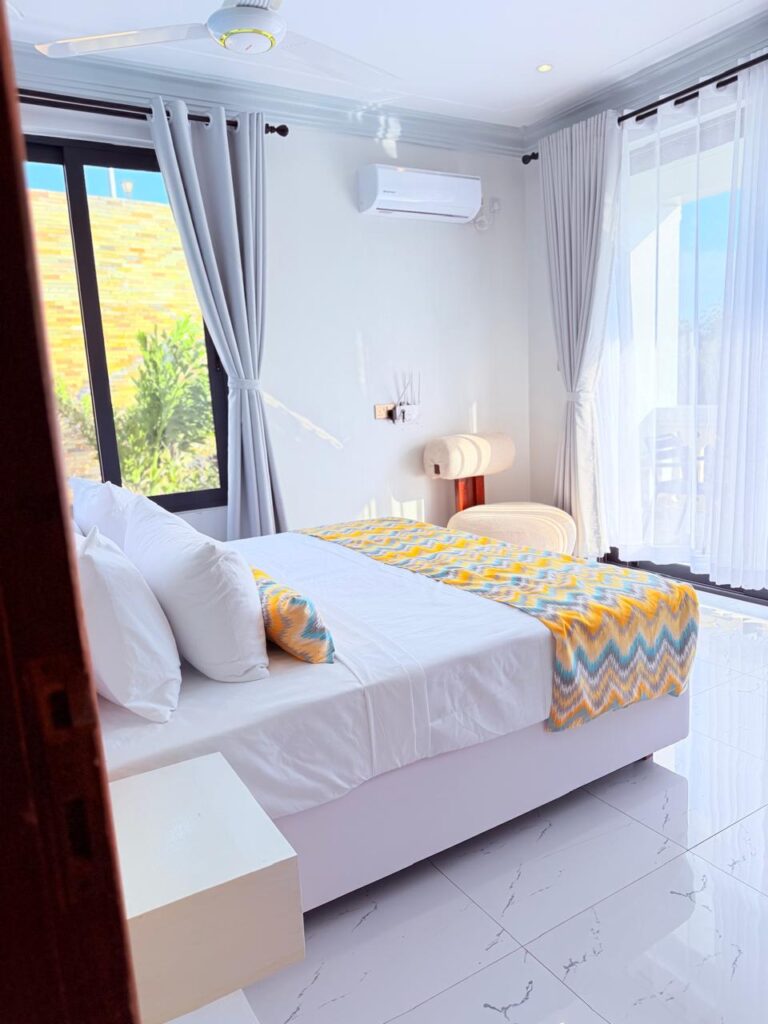 En-suite bedroom with white platform bed