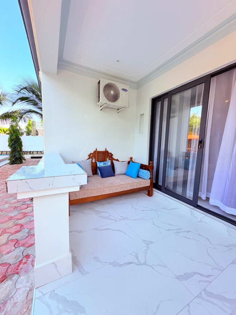 Private terrace daybed with blue cushions