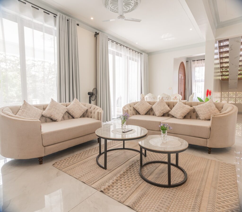 Main lounge with twin Chesterfield sofas and marble tables
